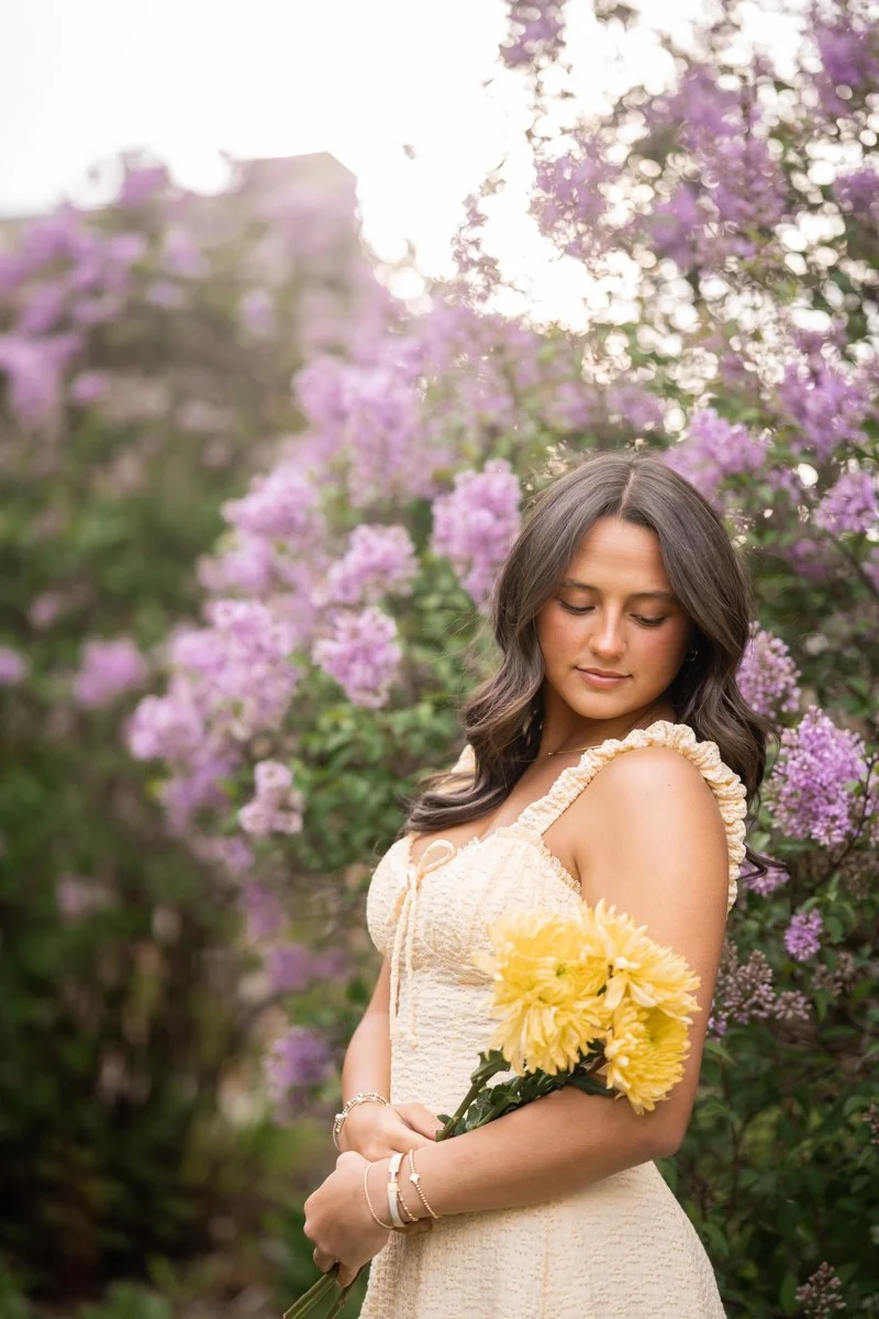 a backlit portrait in a flowery setting