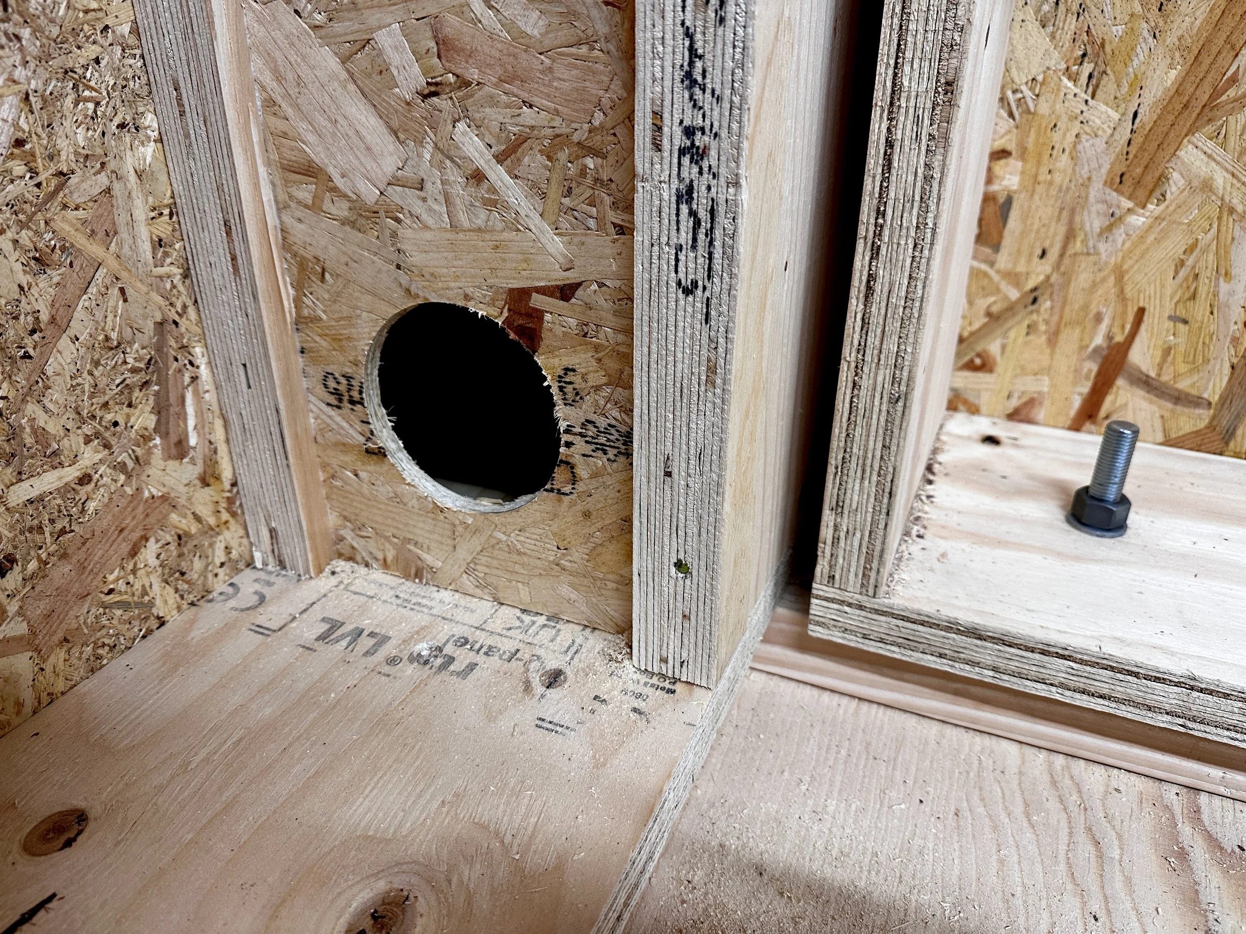 Close-up of precision timber joinery used in off-site tiny home panels.