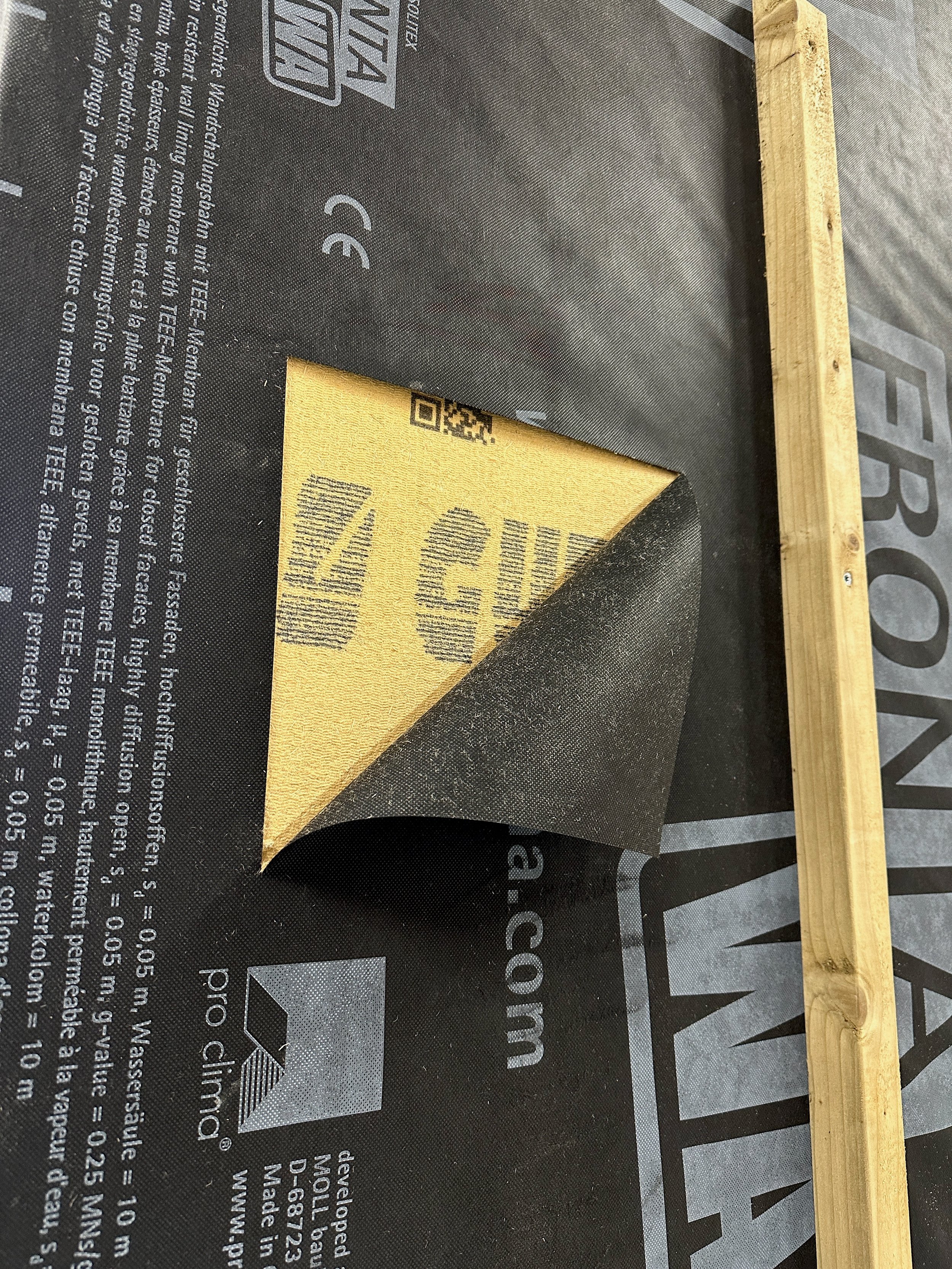 Wood-fibre insulation board added to a tiny home wall build-up.