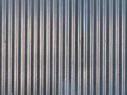 Metal sheet cladding detail on a contemporary tiny home.