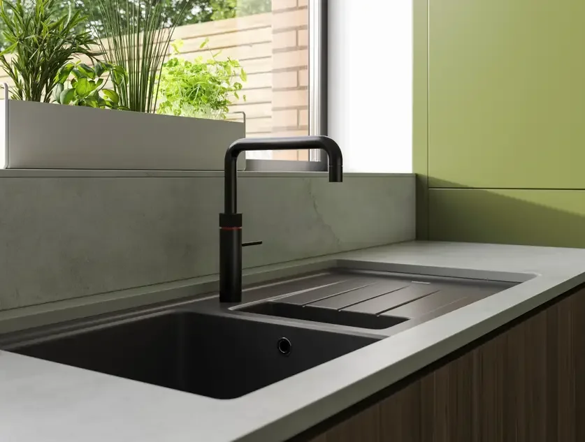 Compact kitchenette designed for a modern tiny home.