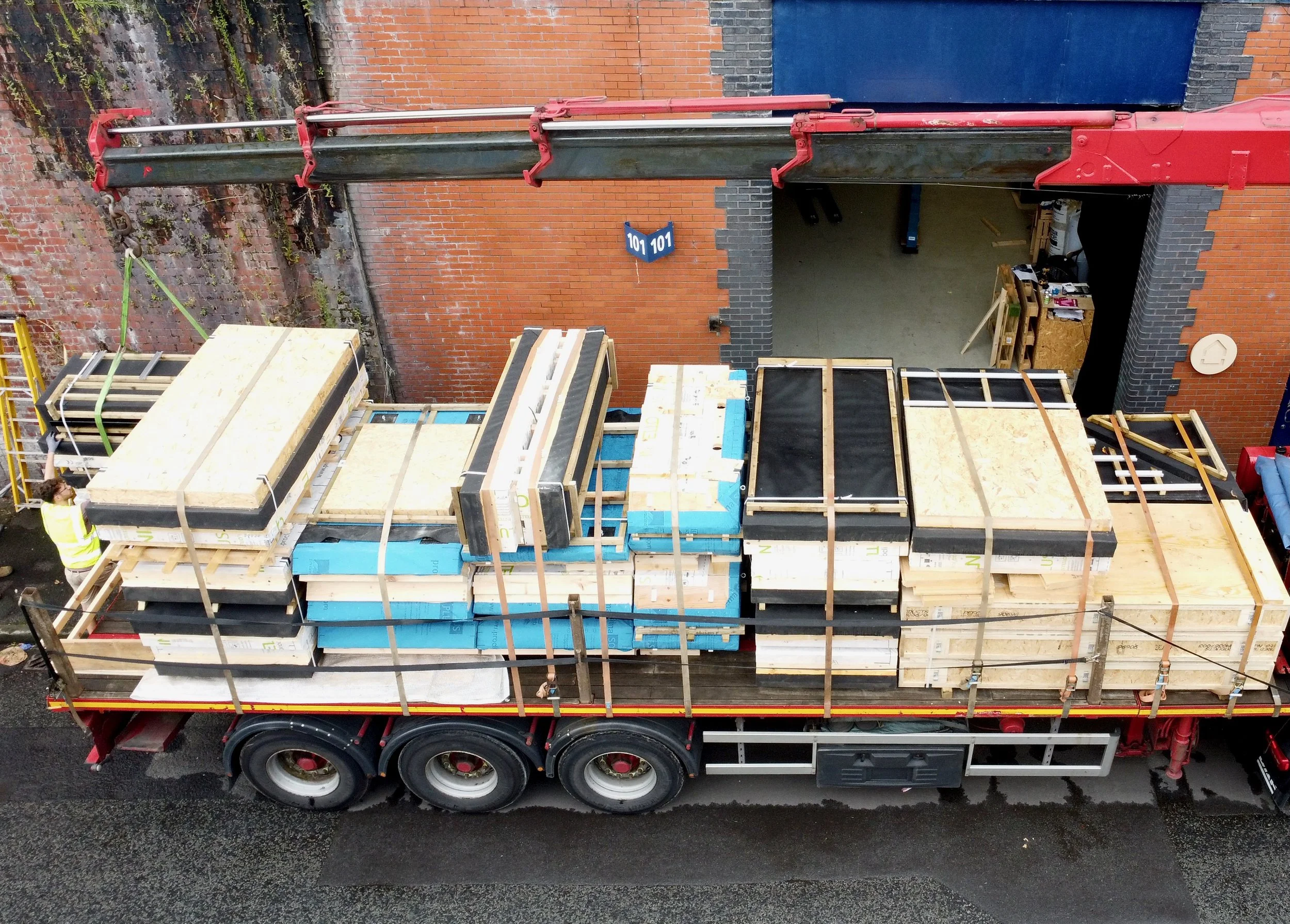 UK-made timber panels for compact tiny homes being prepared in a Manchester workshop.