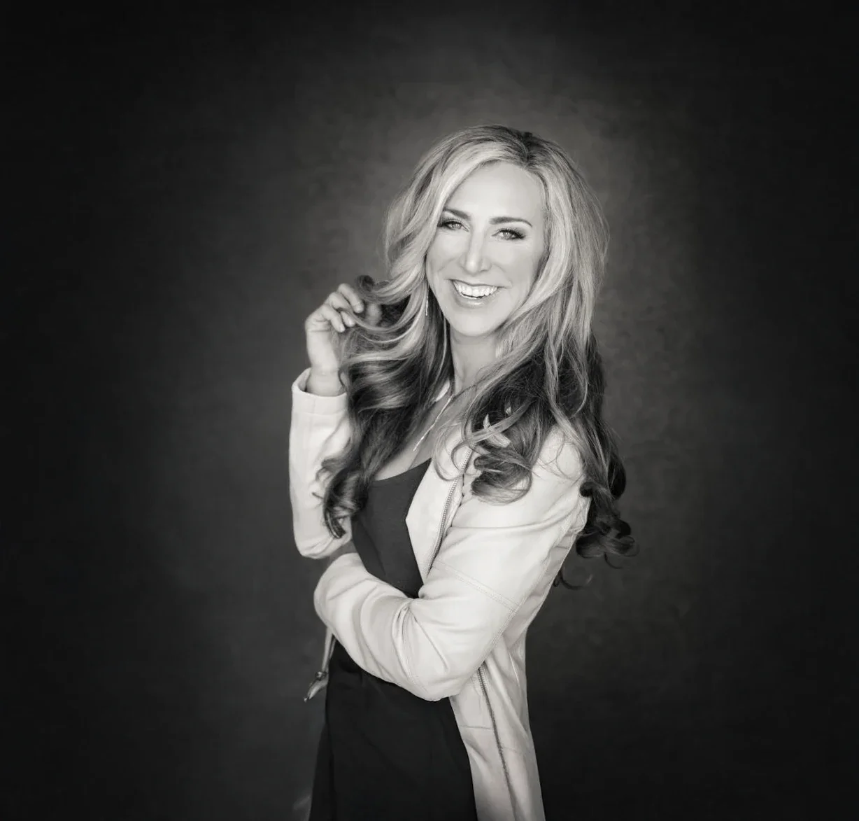 Professional portrait of keynote speaker Lisa Fierer smiling.