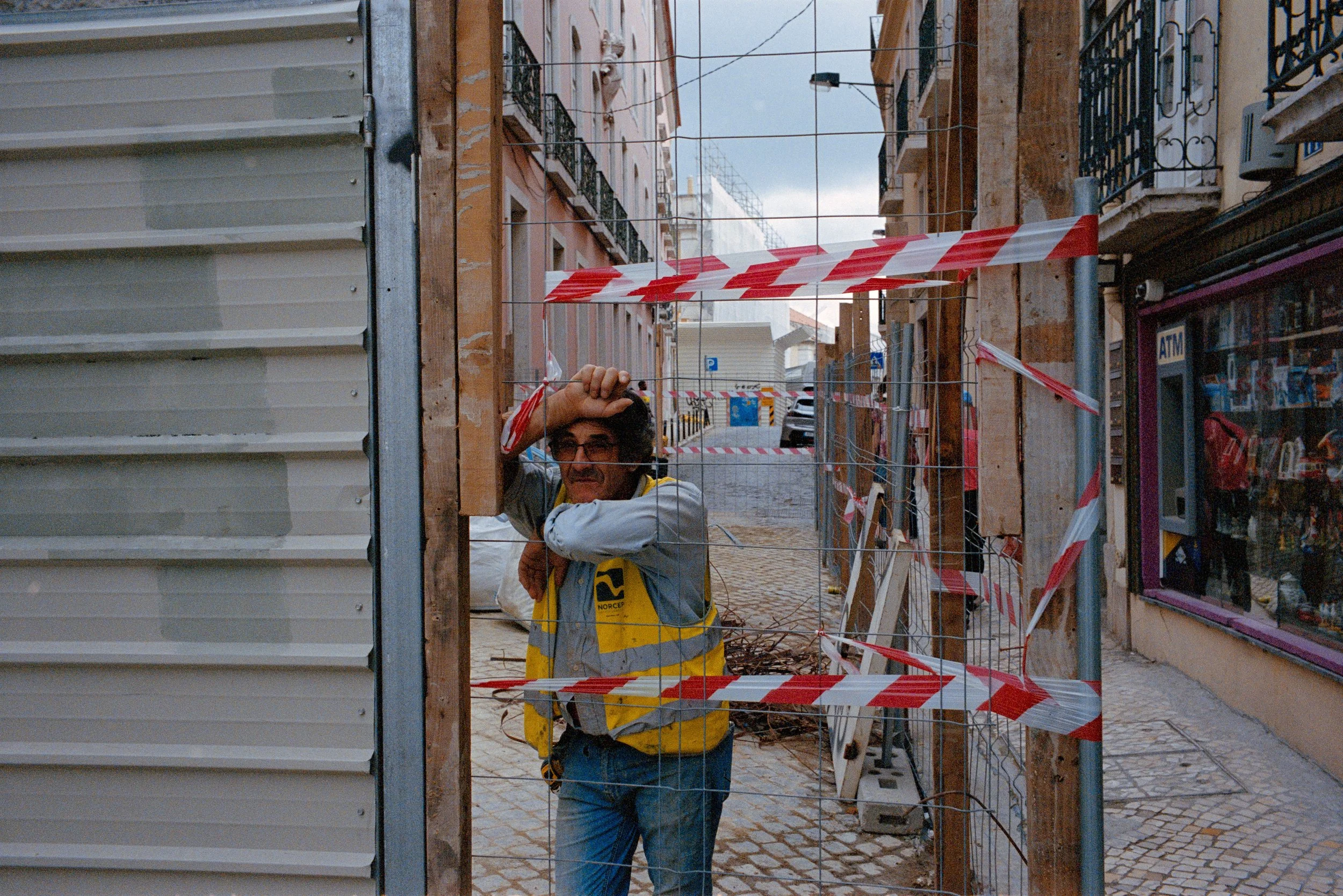 street-photography-portugal-yanis-machonis-worker-with-red-tape.jpg