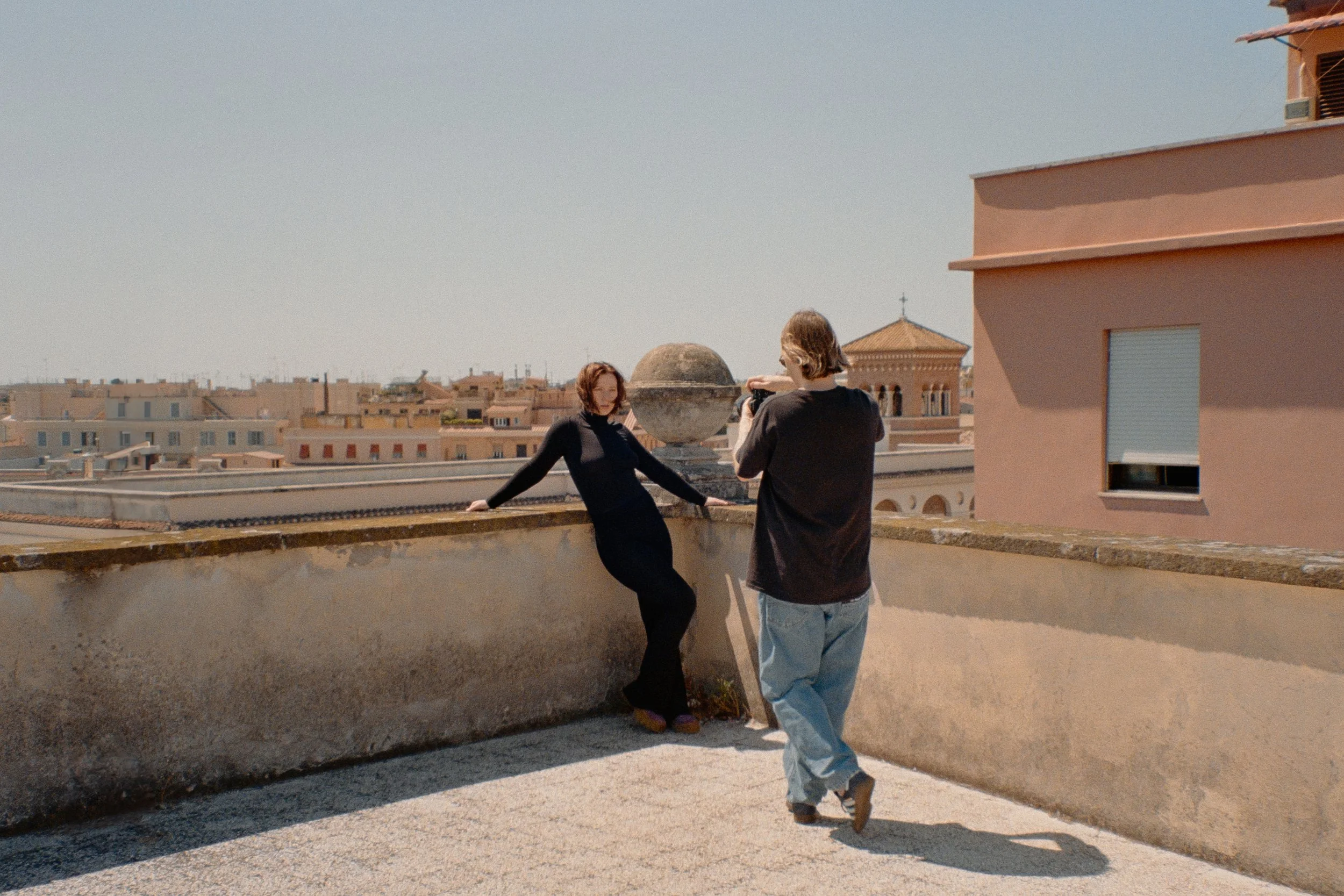 Self-portrait by Yanis Machonis on a rooftop in Rome — exploring presence, space, and observation