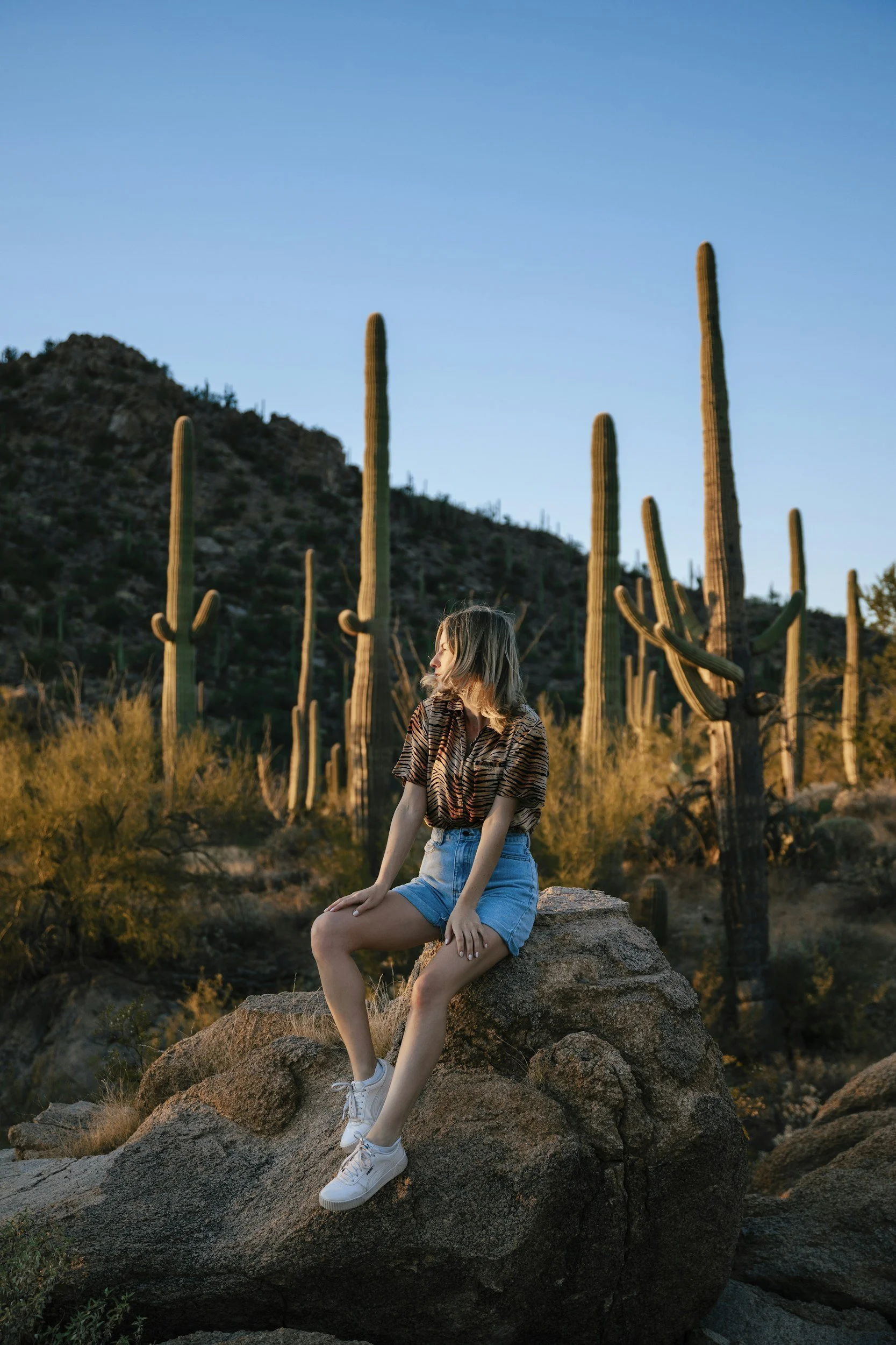 View of a woman appreciating Phoenix, Arizona at sunrise symbolizing hope and recovery after a car accident.