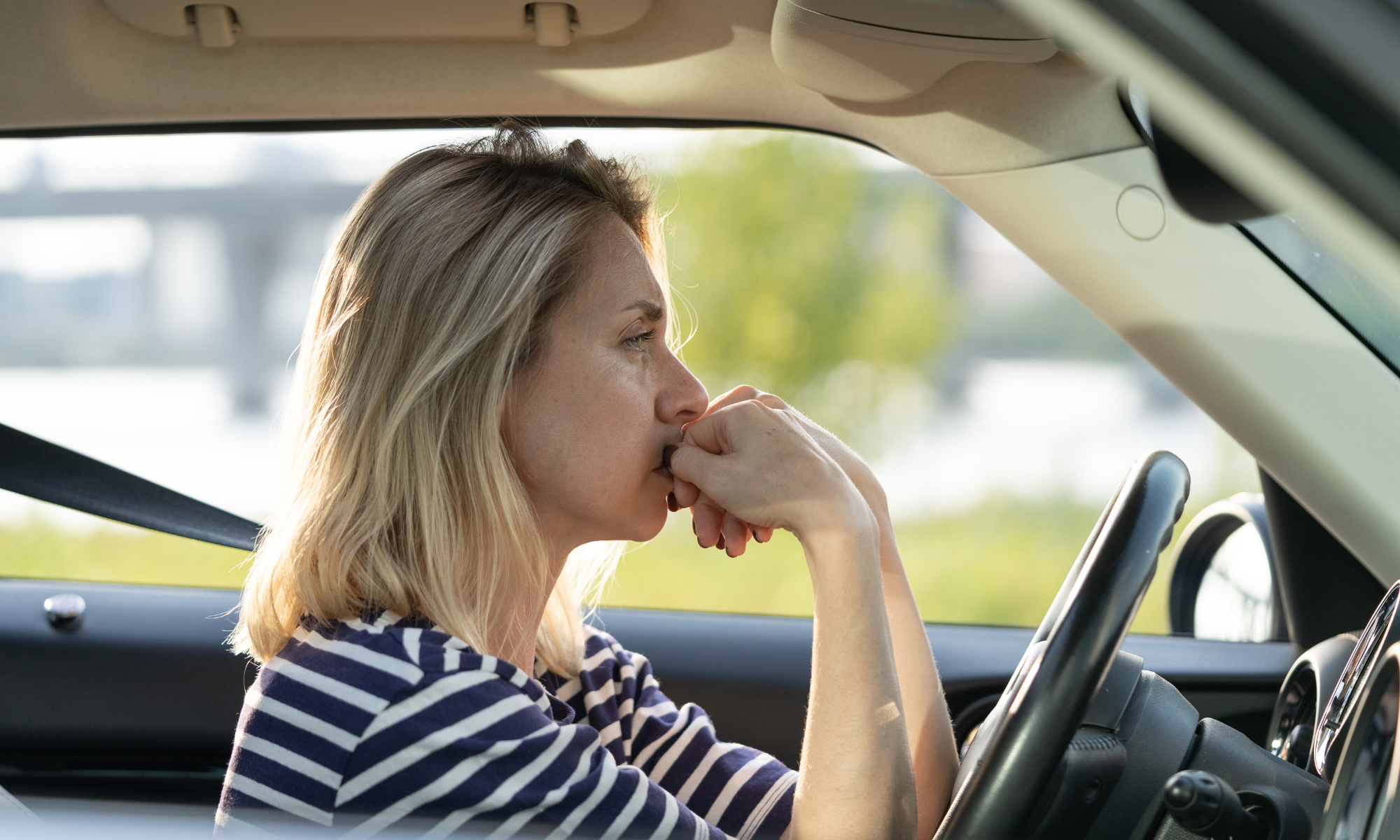 Arizona woman taking a deep breath before driving after a car accident