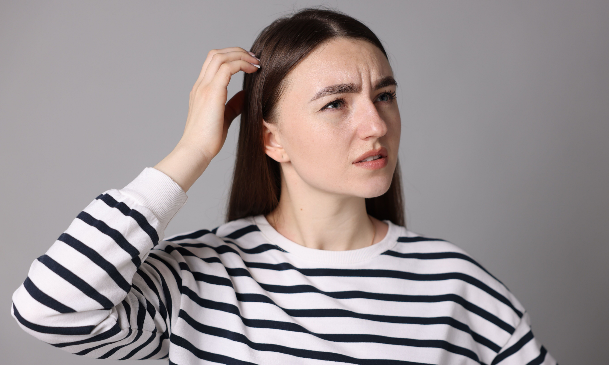 Woman Experiencing Forgetfulness Common Concussion Symptoms After a Car Crash in Phoenix