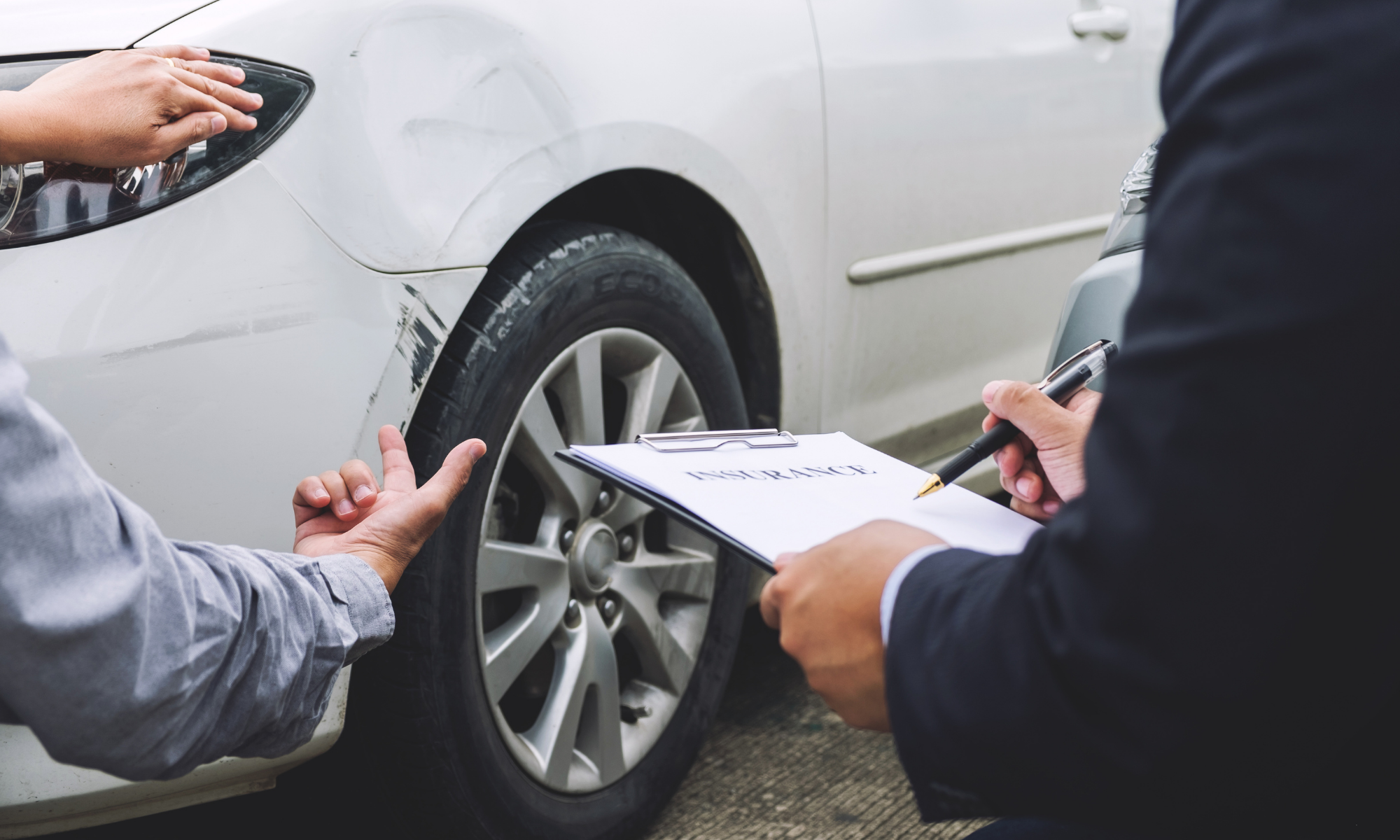 Police officer documenting an intersection accident scene