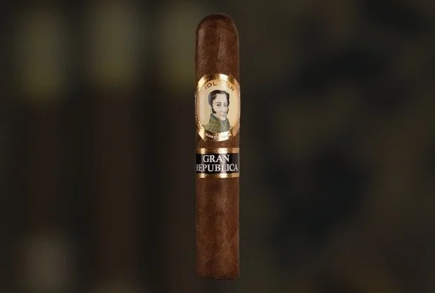 A cigar with a band featuring a portrait of a woman and the words 'Gran Republica'.