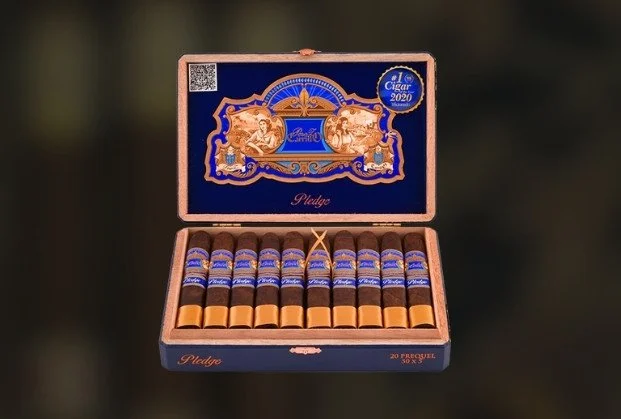 Open box of 20 cigars with gold and blue labels inside a decorative blue and gold cigar box.