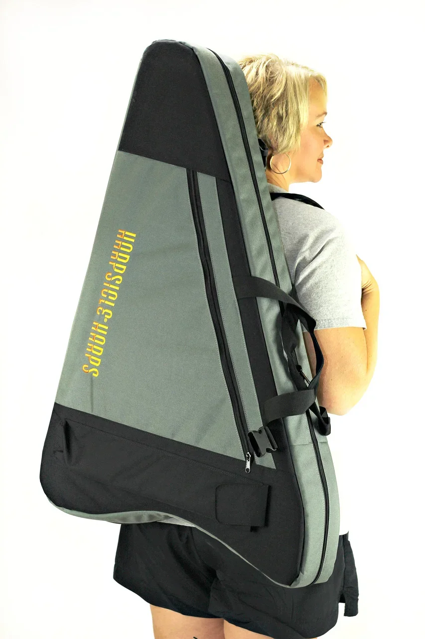 Rees+Harps+Green+Bag+w+Model+Back+Vertical+.webp