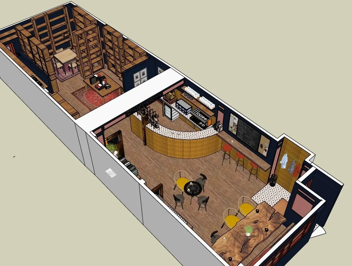 Open-concept coffee bookshop interior with a bar area, seating, and a back room with bookshelves and a small table.