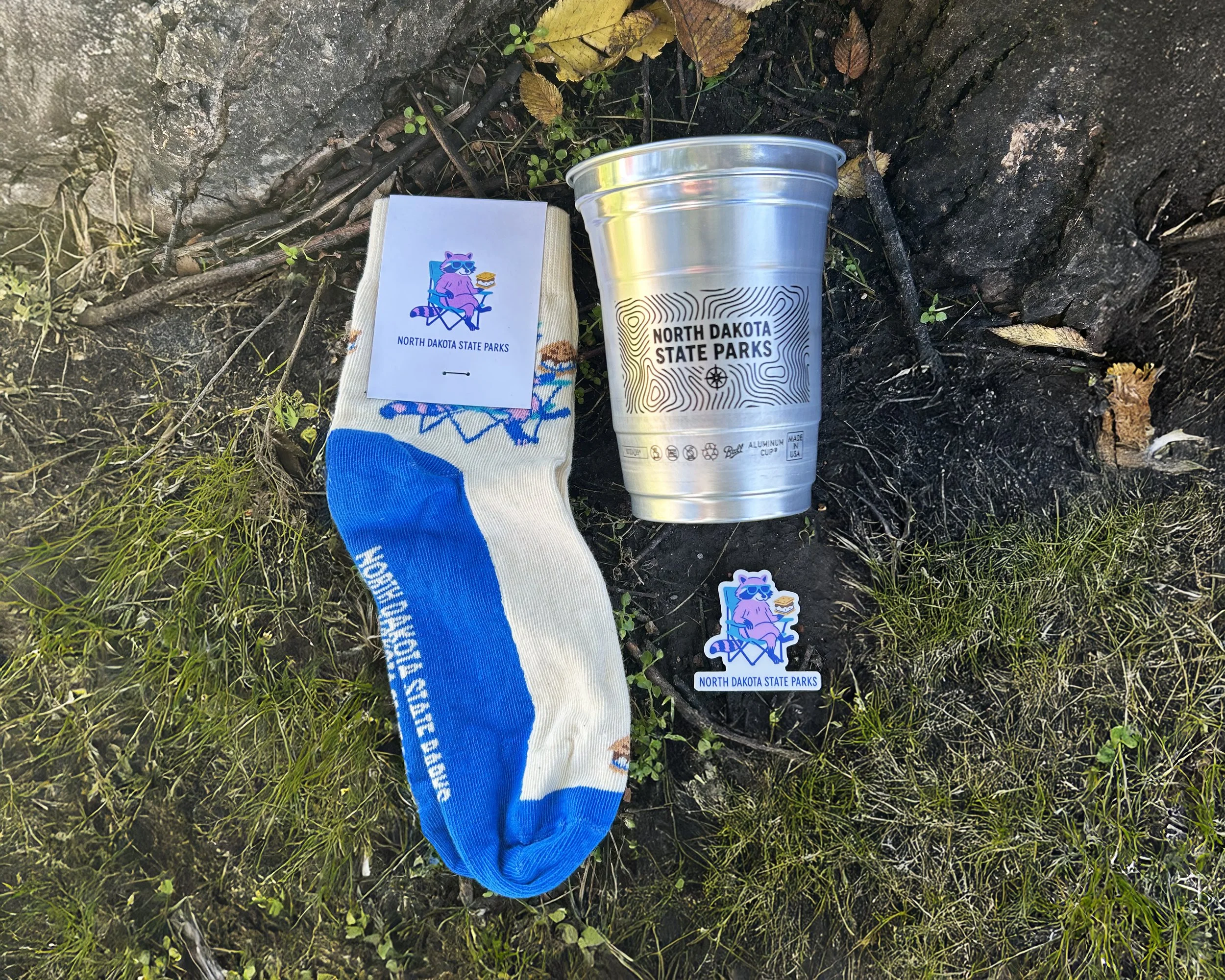Bundle of products including Roscoe socks, aluminum cup and Roscoe sticker