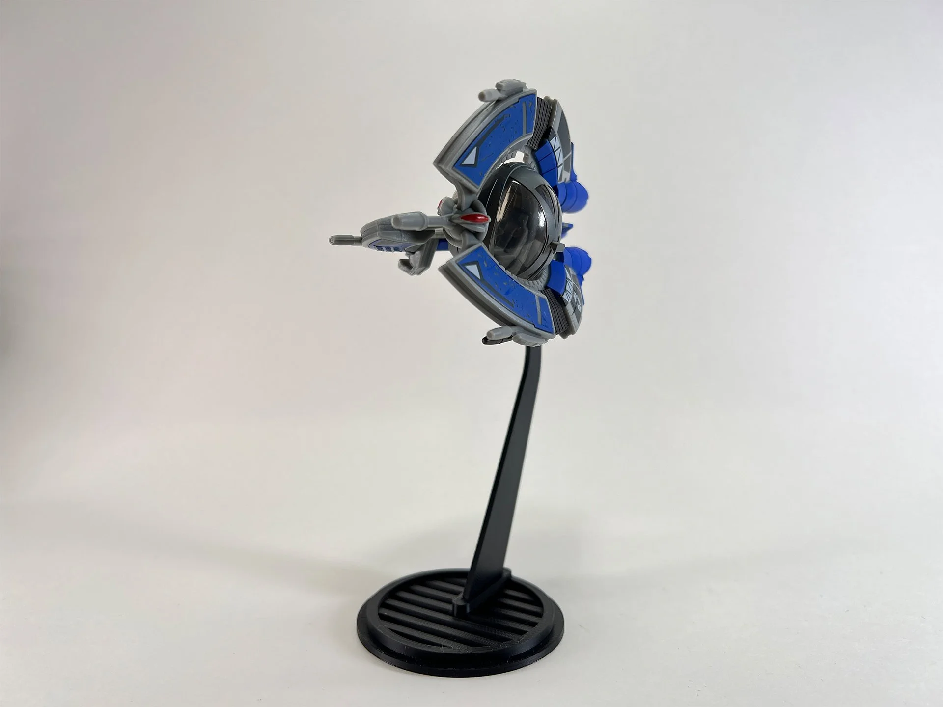 A detailed model of the Tri Fighter Flight Stand from Star Wars, displayed on a black stand against a plain white background.