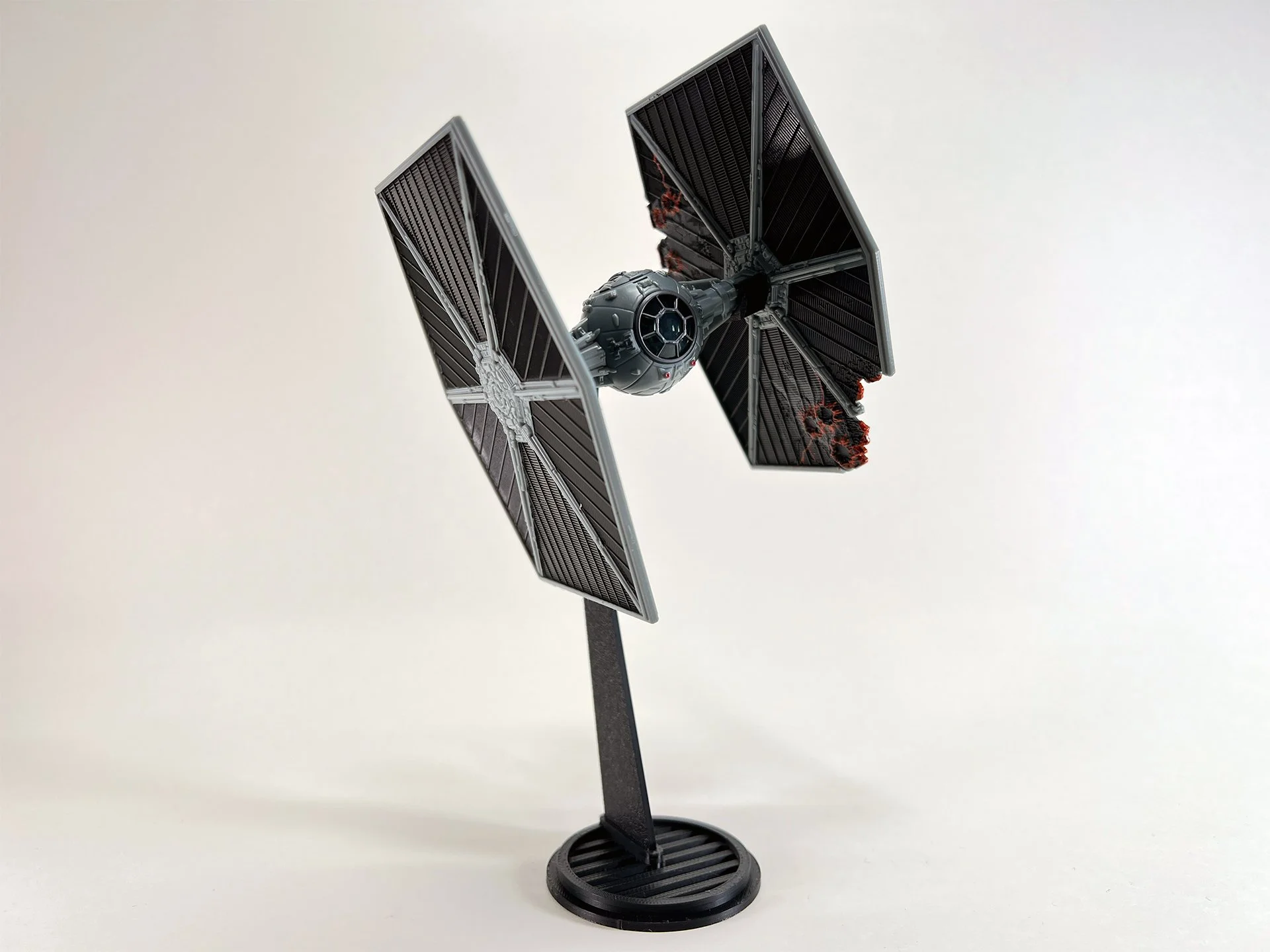 Tie Fighter Flight Stand, part of the Micro Galaxy Squadron series, presented on a sleek black stand against a plain background, ideal for Star Wars merchandise displays.