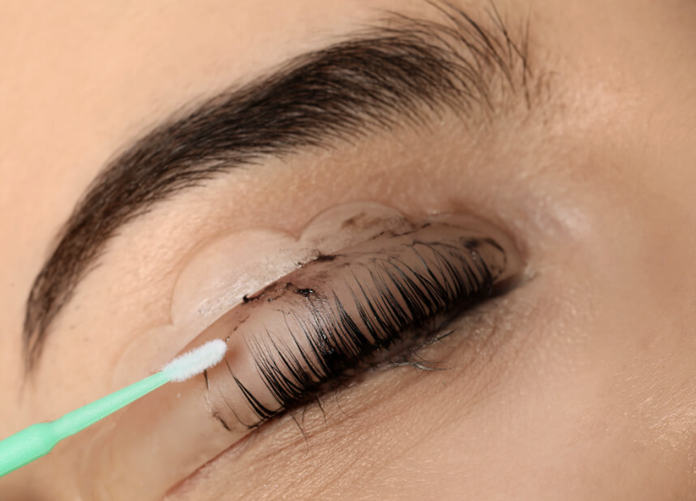 Close-up of eyebrows getting a lash tint treatment. 