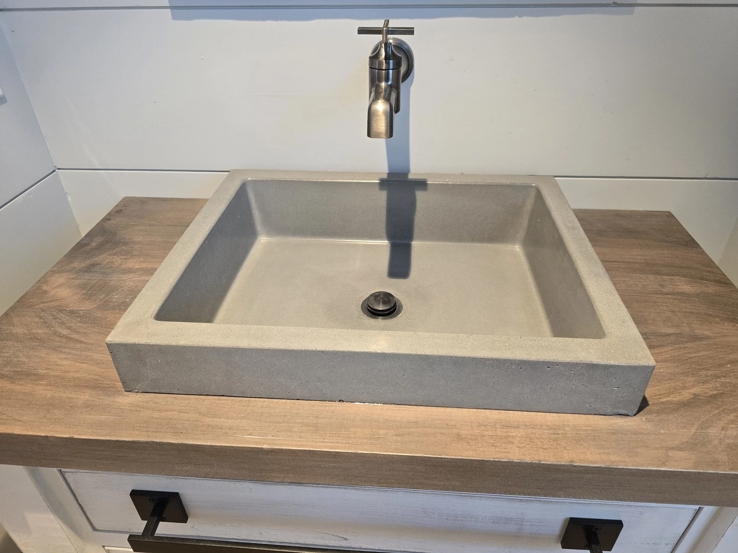 Square concrete Standard Vessel sink on a wood vanity