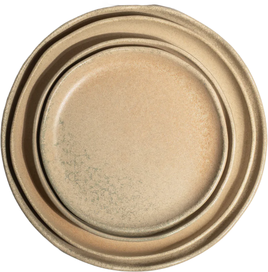 Stacked beige ceramic bowls, top bowl slightly smaller, plain interior, on a dark background.