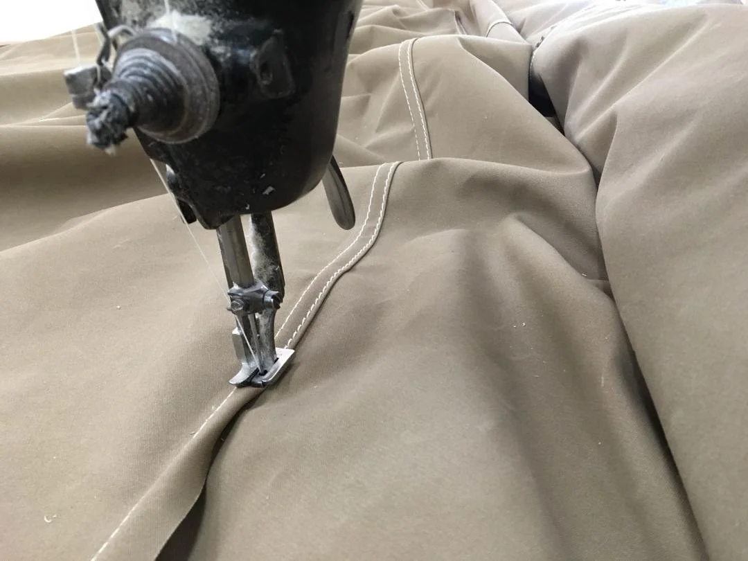 Hand stitching canvas canopy fabric for outdoor classroom canopy UK made in Cornwall