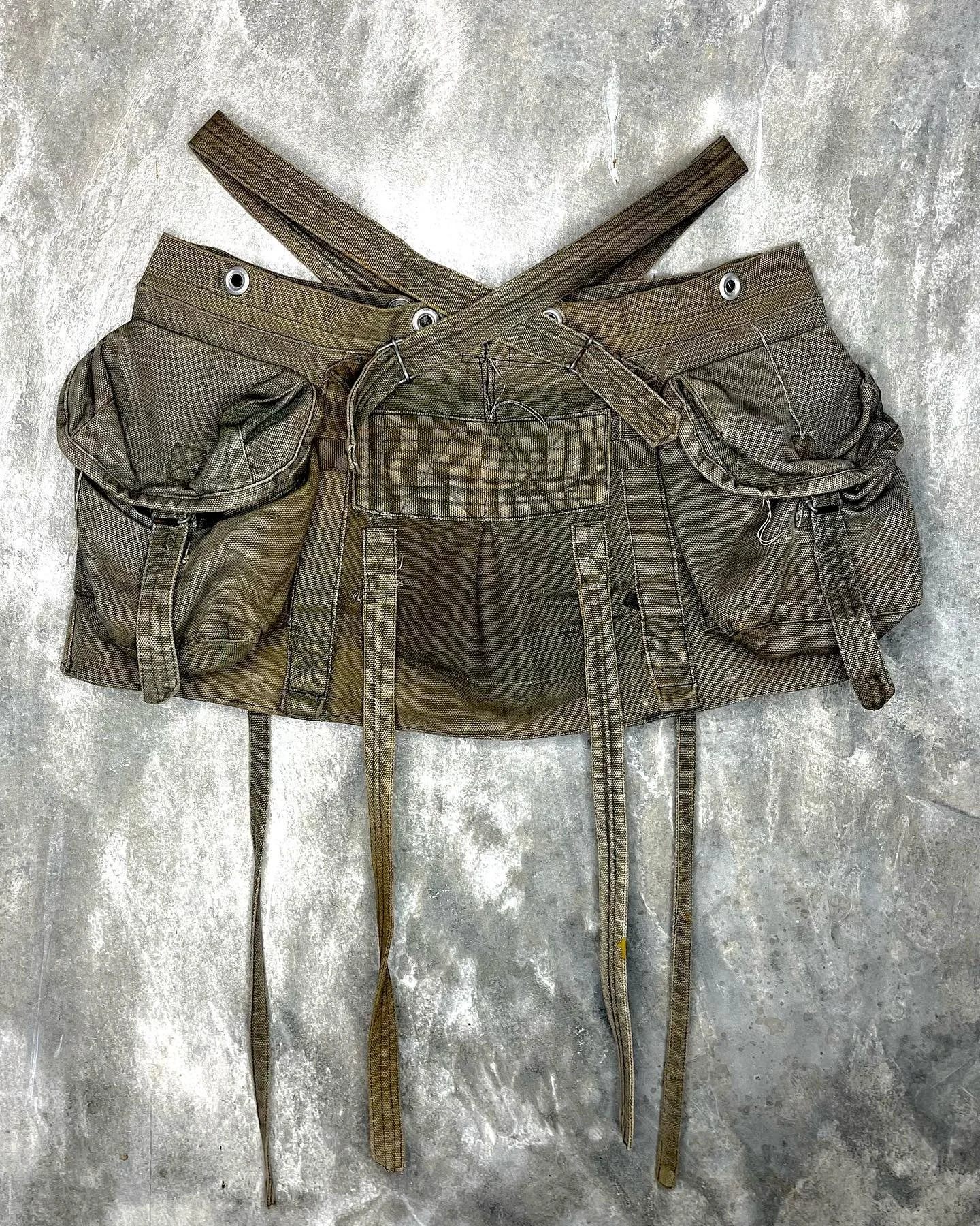 Some more pics of the last drop, the mini cargo skirt.

Upcycled out of an original backpack that was used during the Vietnam war and that traveled the world before becoming this cute lil garment.

Made out of cotton canvas, all the metallic pieces a