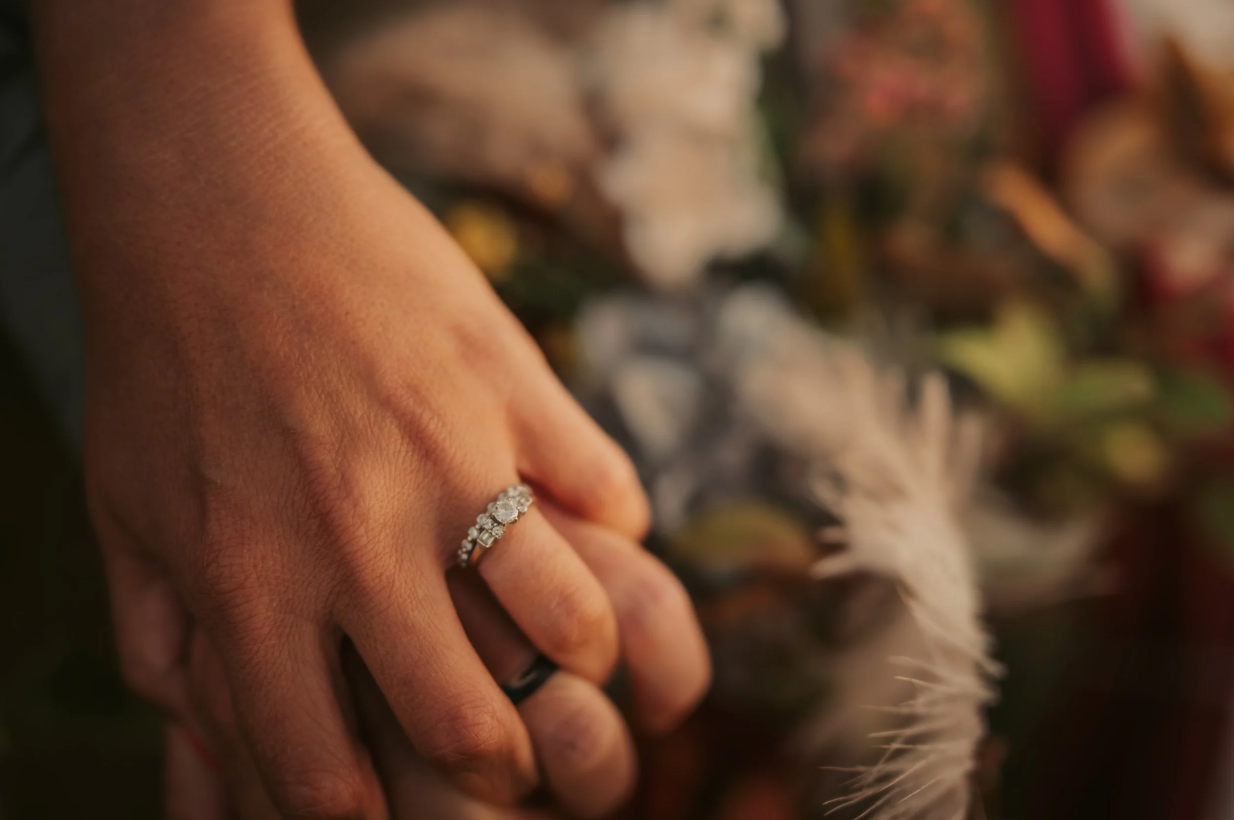 Engaged couple holding hands capturing photos from a professional photographer capturing all the special moments at this Owensboro wedding venue locally owned