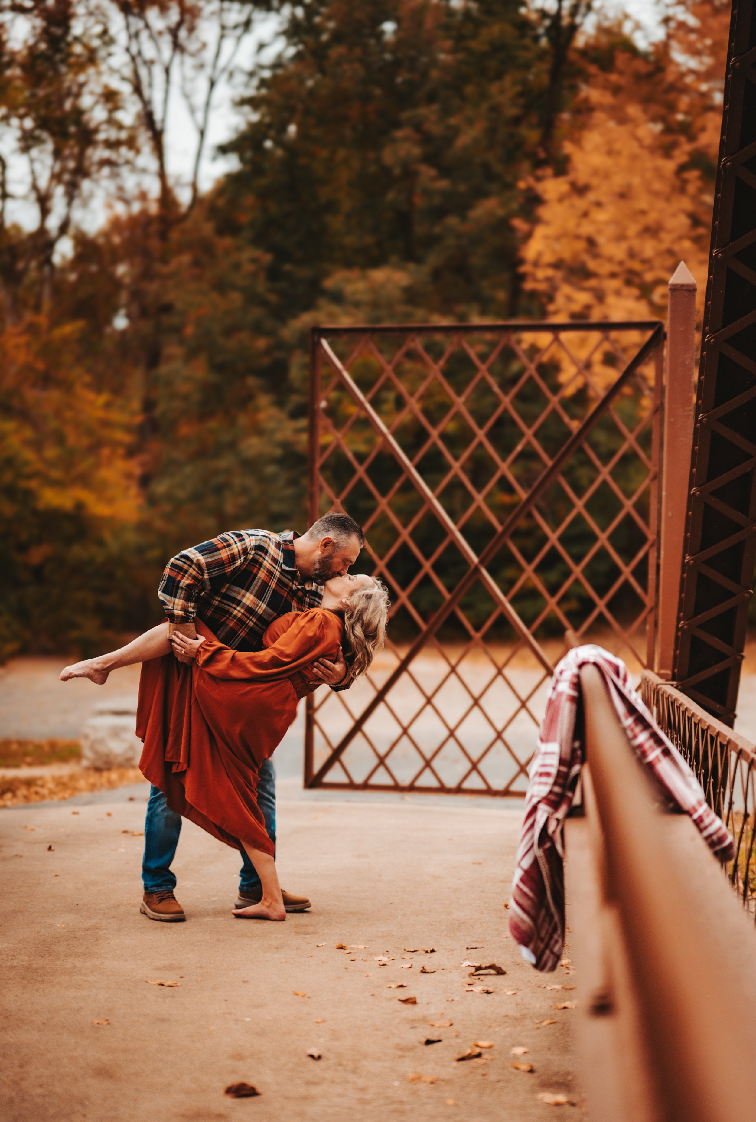 Couples engagement session emphasizing physical touch and emotional connection