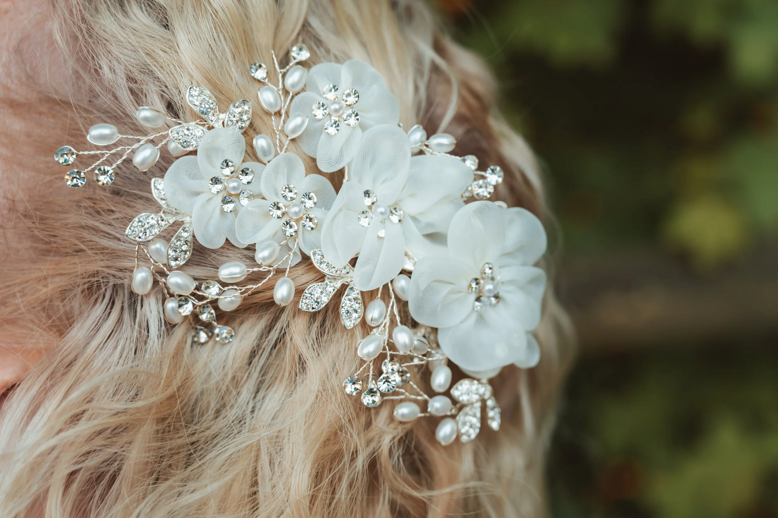 Bride having hair styled by a professional bridal hairstylist at Hilton Farms Wedding Venue