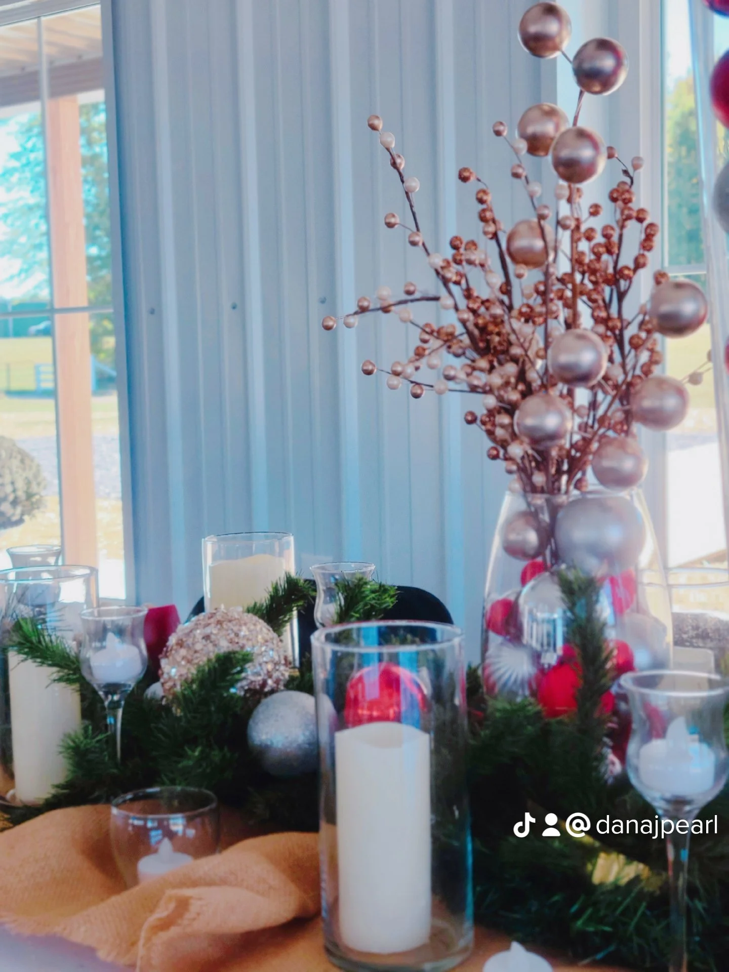 Christmas table decor flameless candles ornaments reds silver and gold burlap table runner pine tree greenery wine glass tealights black chair covers Nashville Tennessee Henderson Bowling Green Hawesville Louisville Kentucky Evansville Newburgh