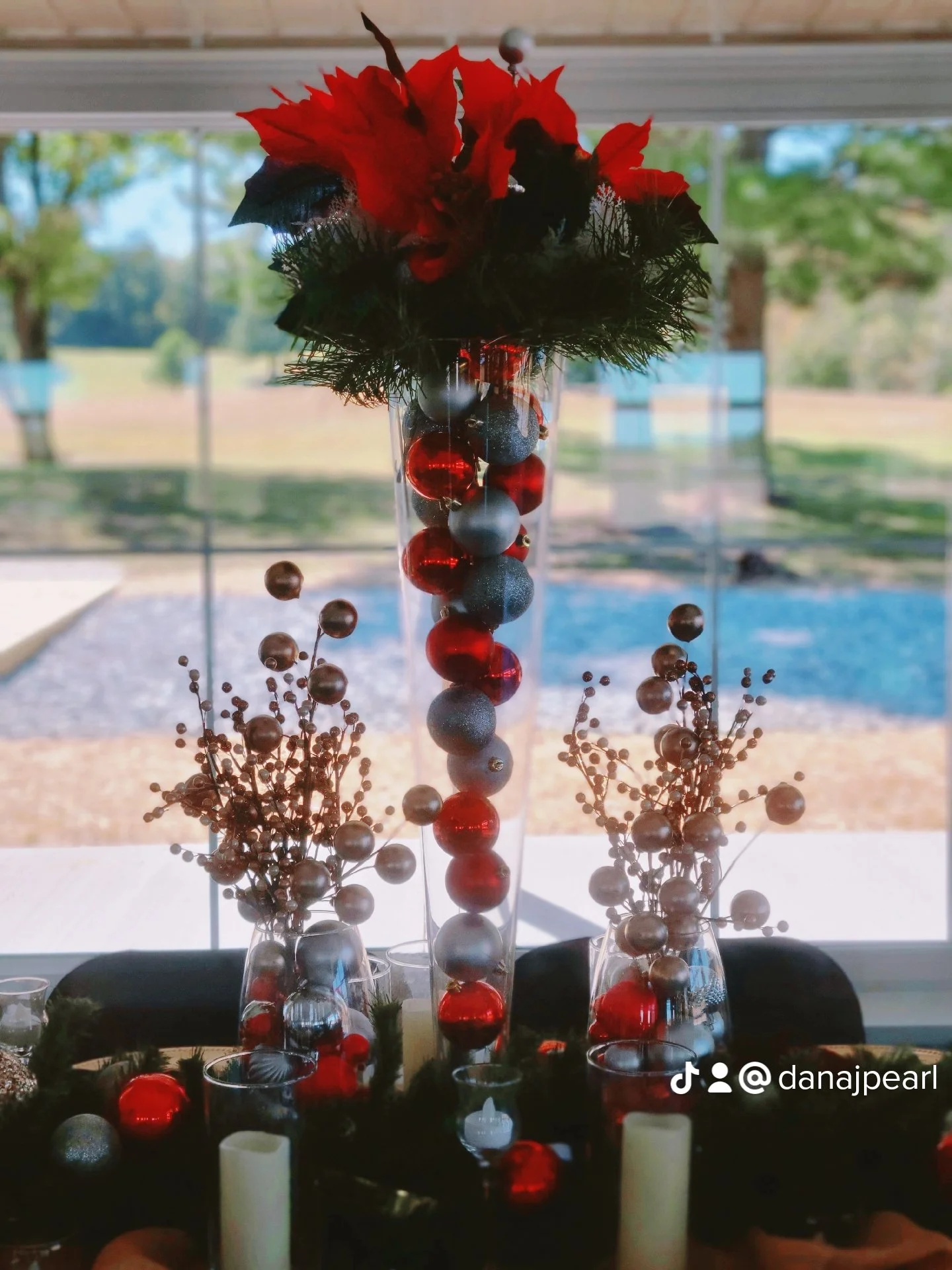 christmas theme table for wedding candles christmas ordainments silver red black burlap runner black chair covers tea light candles large glass vases light runners wine glasses