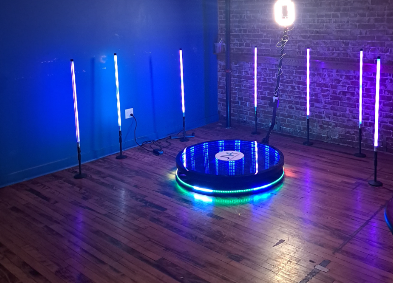Bride and groom posing in a photo booth at Hilton Farms wedding reception