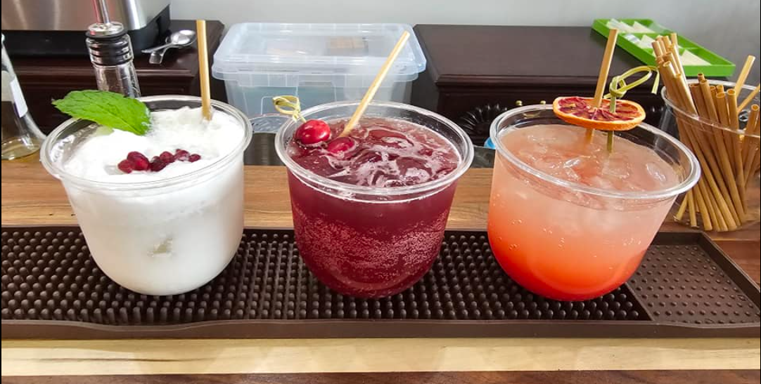 Professional bartender mixing signature cocktails at a Kentucky wedding