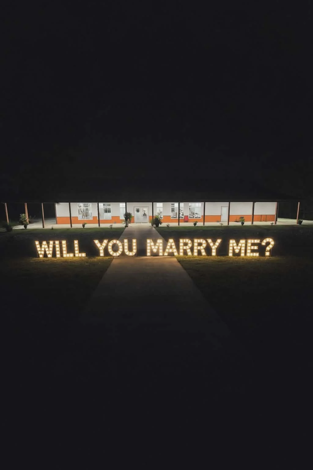 Proposal will you marry me light up sign for engagement session in Utica Kentucky Hilton Farms Elegant lights along the bridge for the perfect Christmas Eve Proposal idea