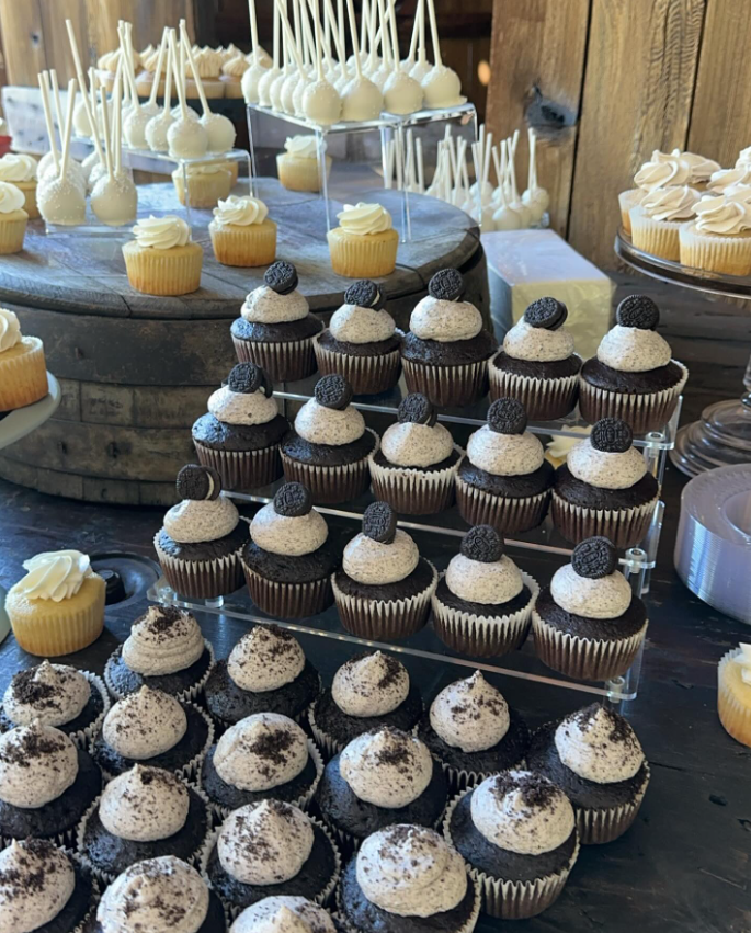 Dessert table with cupcakes and cookies from an Owensboro wedding bakery