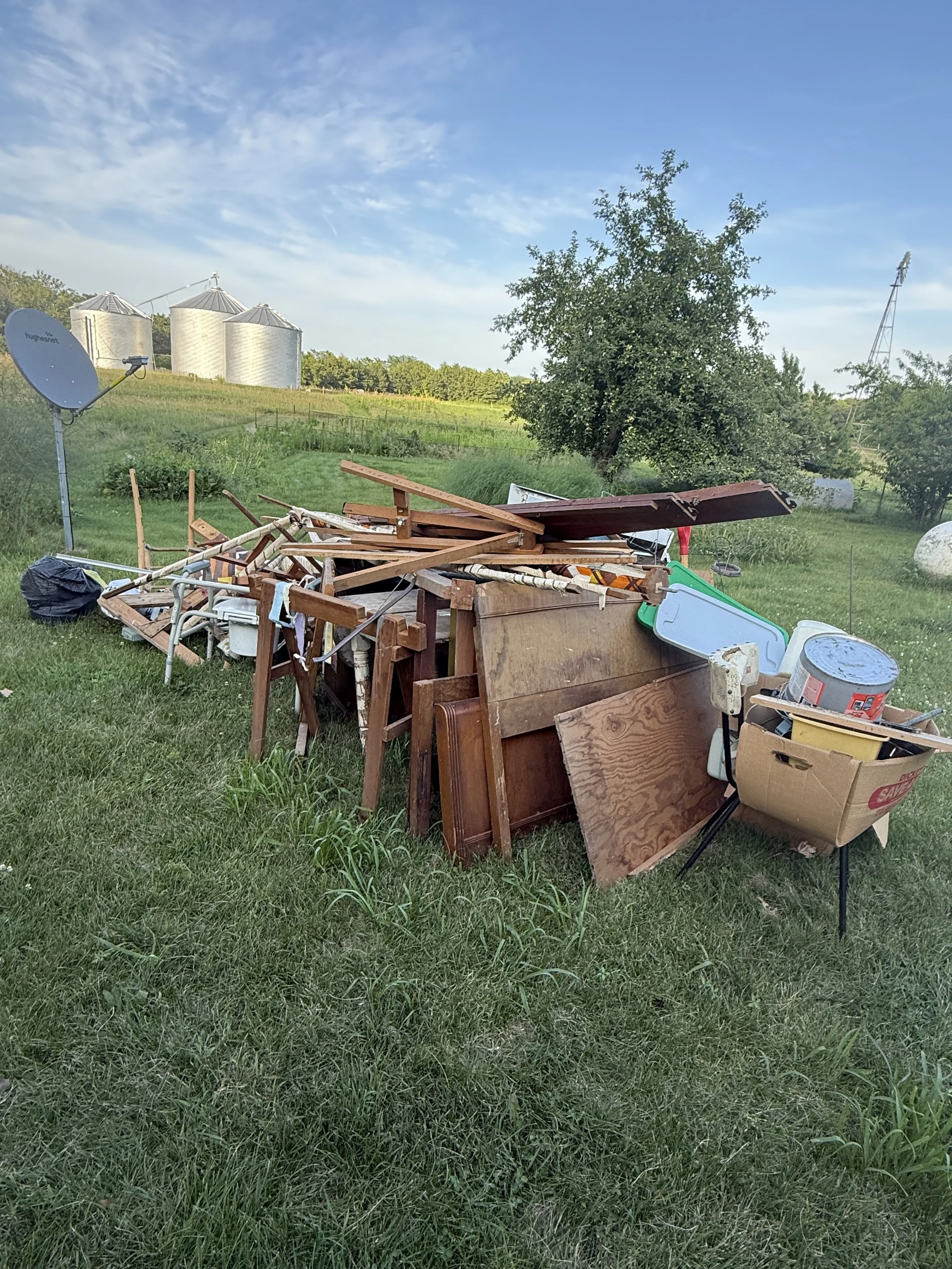 Junk pile from a residential yard cleanout by Junk Hero Hauling