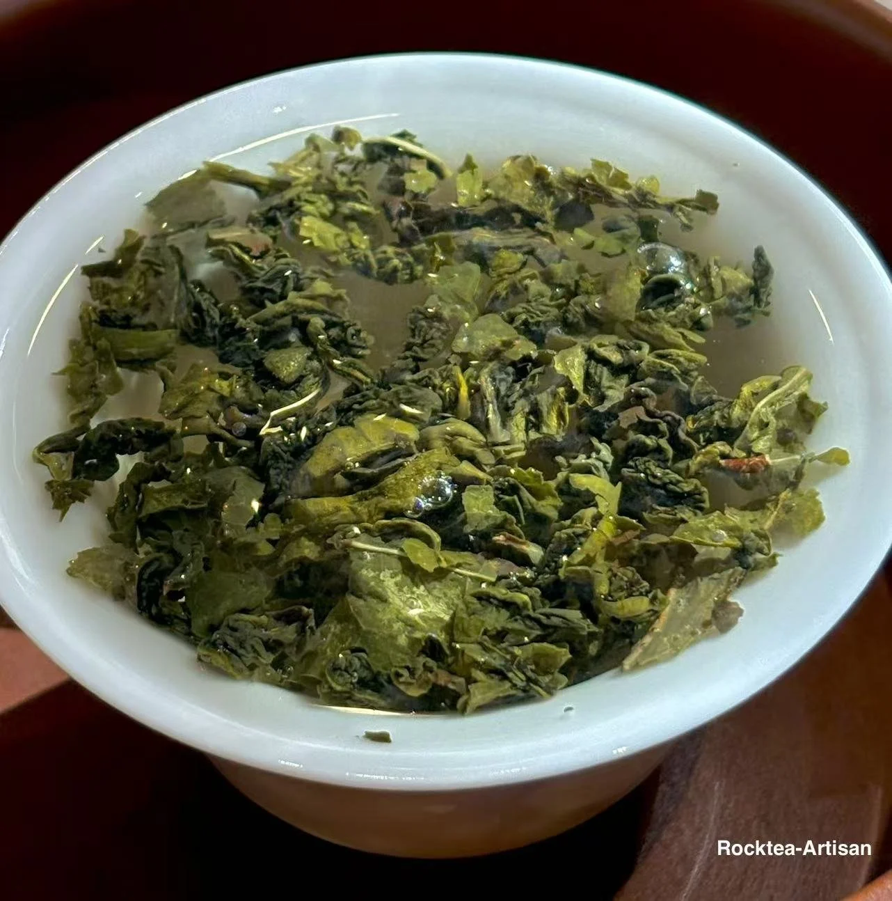 Golded honeydew oolong  leaves unfurled in a gaiwan