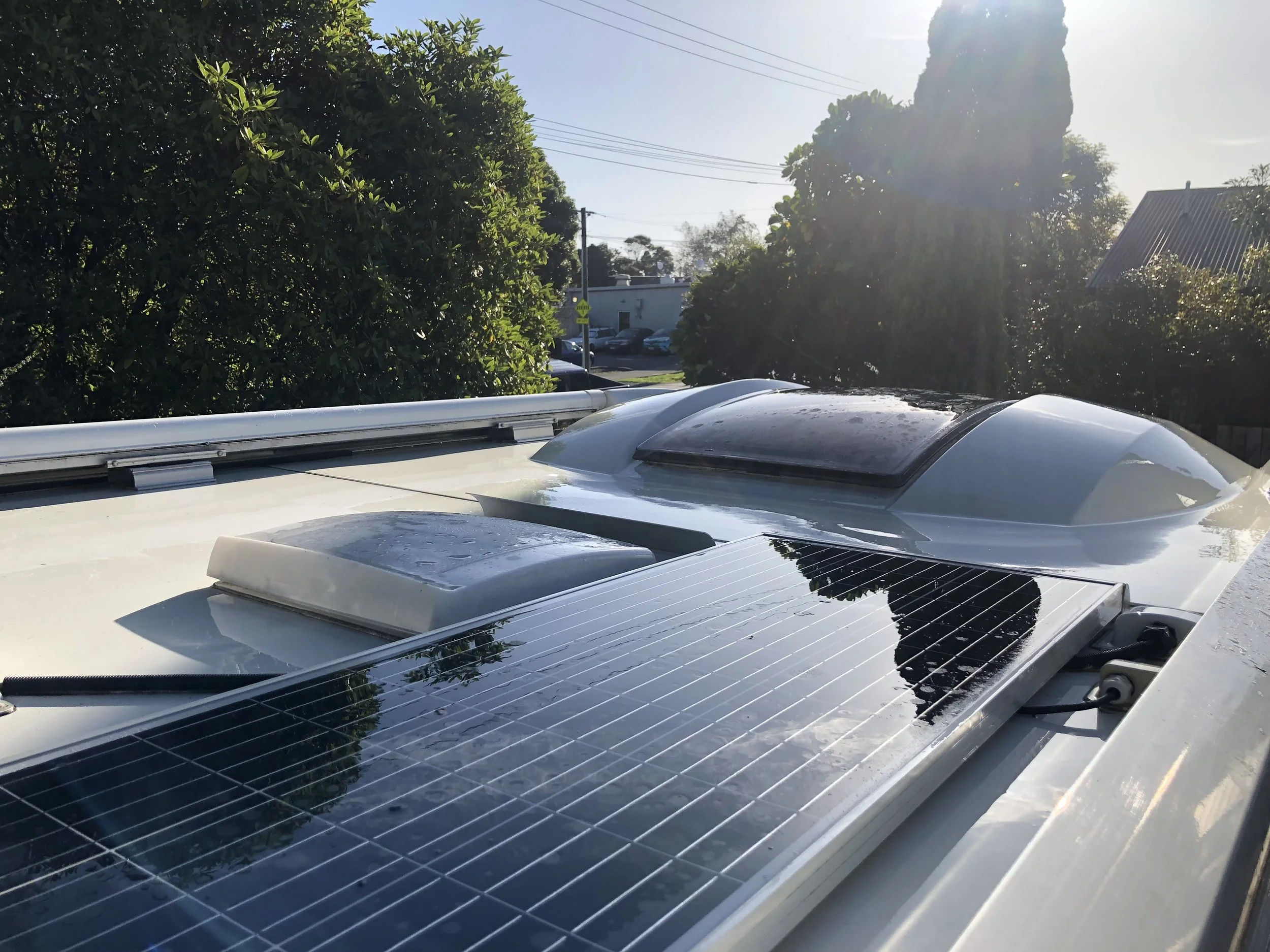 Clean white campervan roof shining after deep wash and detailing service. 