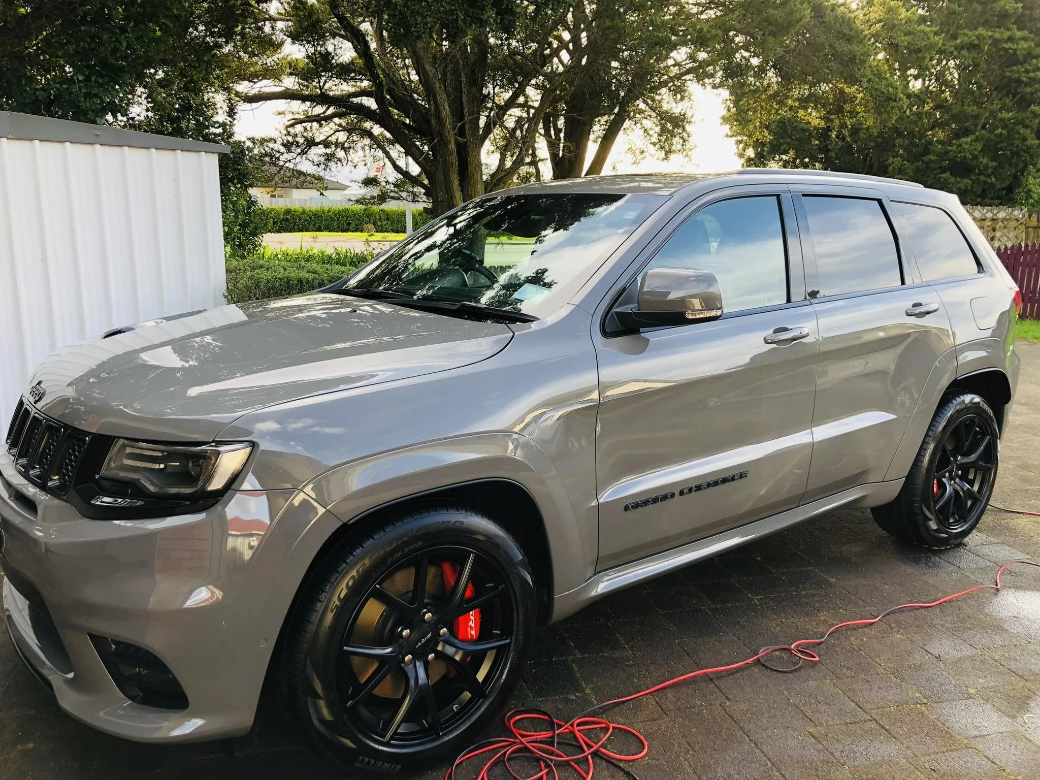 A Jeep Grand Cherokee polished and waxed for a glossy showroom shine.