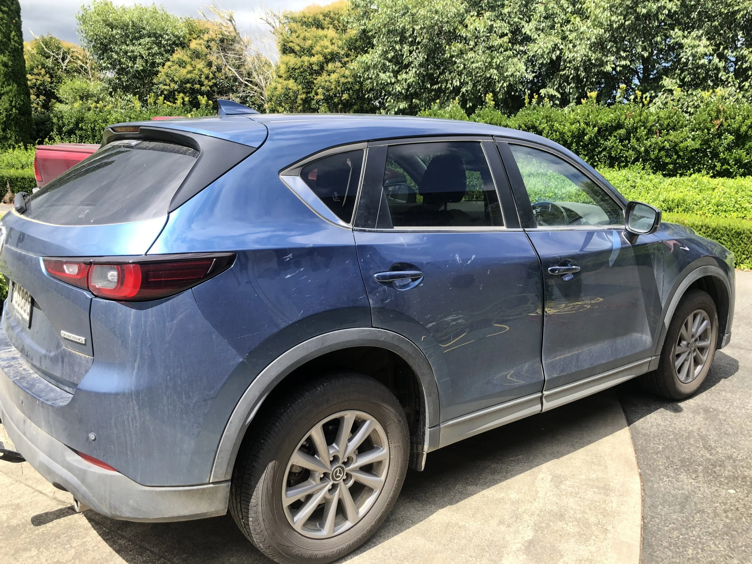 Car exterior dull and dirty before wash, polish, and detailing.