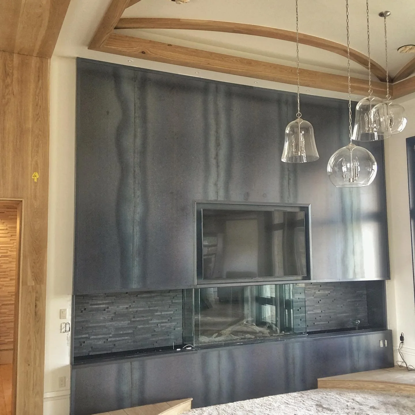 Love how this cladded hot rolled steel fireplace turned out!