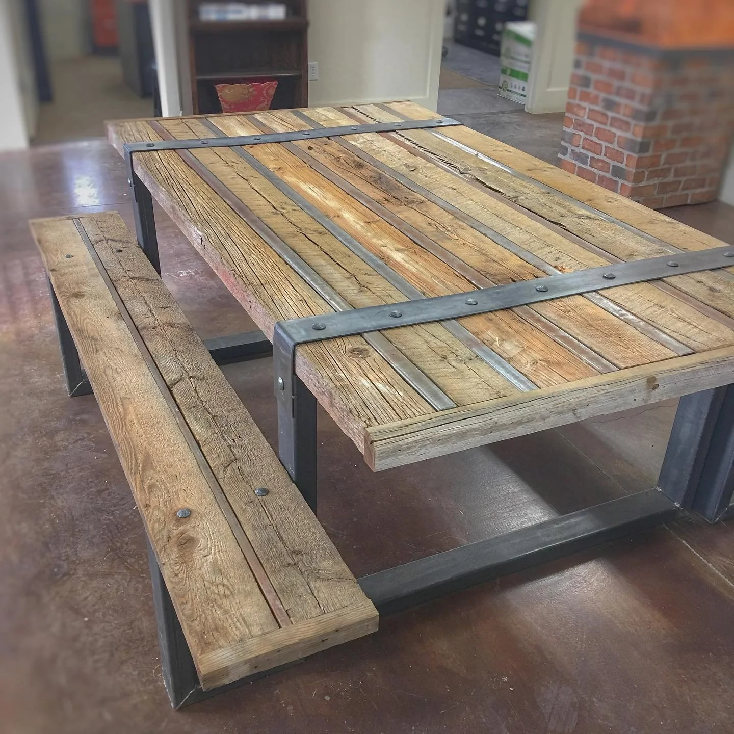 Reclaimed wood and steel table with benches.