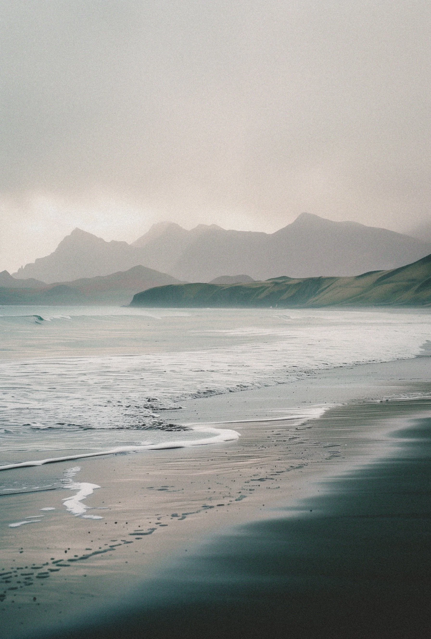 Peaceful shoreline with mountains and water representing reflection and inner healing.