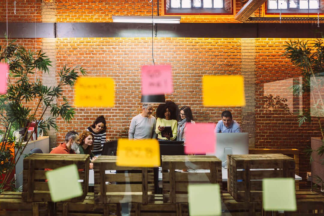 Office setting, with glass out of focus, sticky notes
