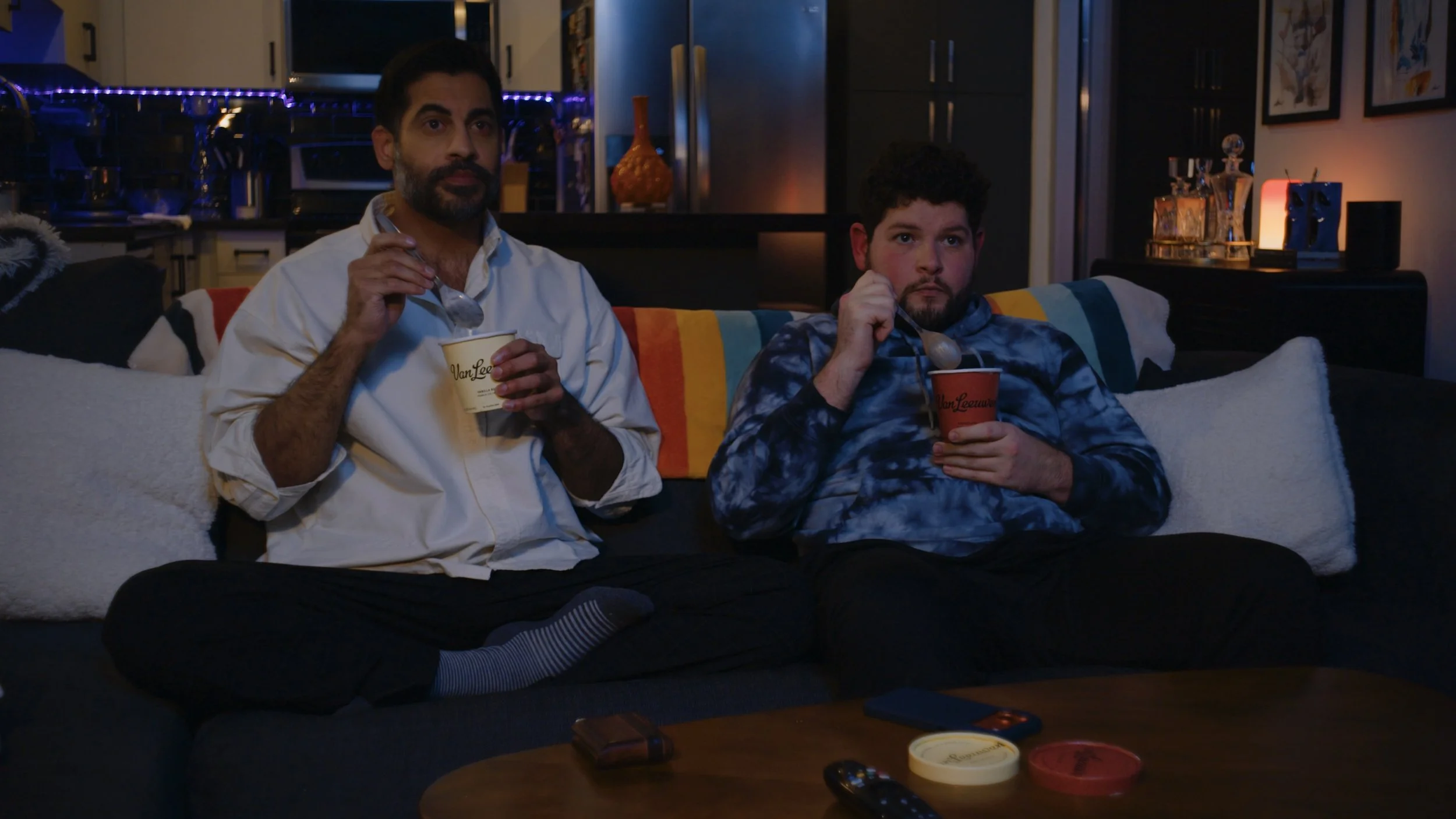 Actors Sachin Bhatt and Nicholas Molencupp eating ice cream as Ezra and Nick in a scene from the film In Between