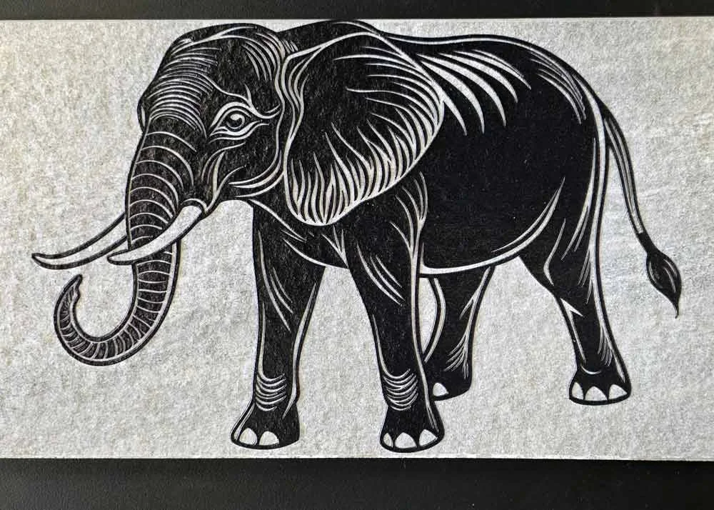 Black and white artistic depiction of an elephant with intricate line details.
