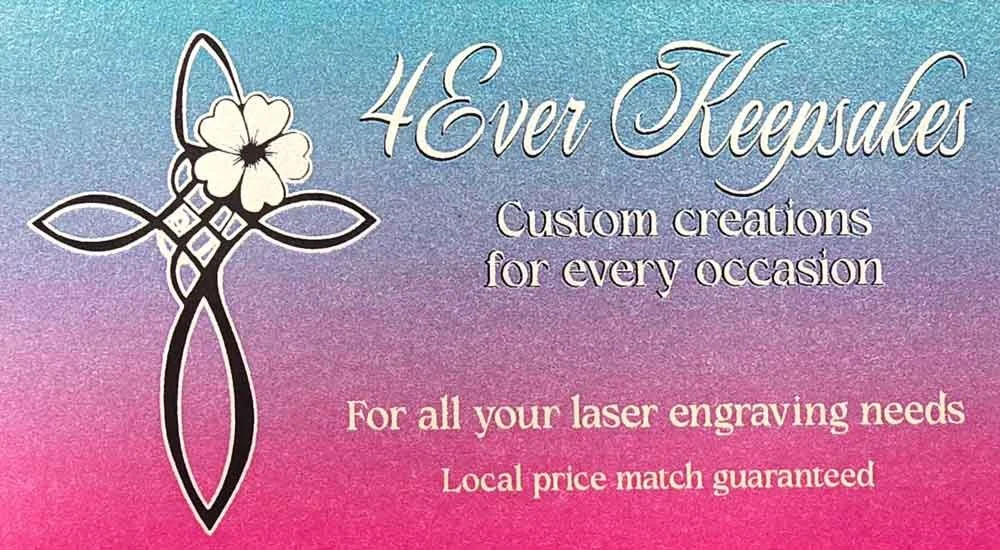 Business card for 4Ever Keepsakes offering custom laser engraving for various occasions with local price match guarantee, featuring a flower and Celtic knot design.