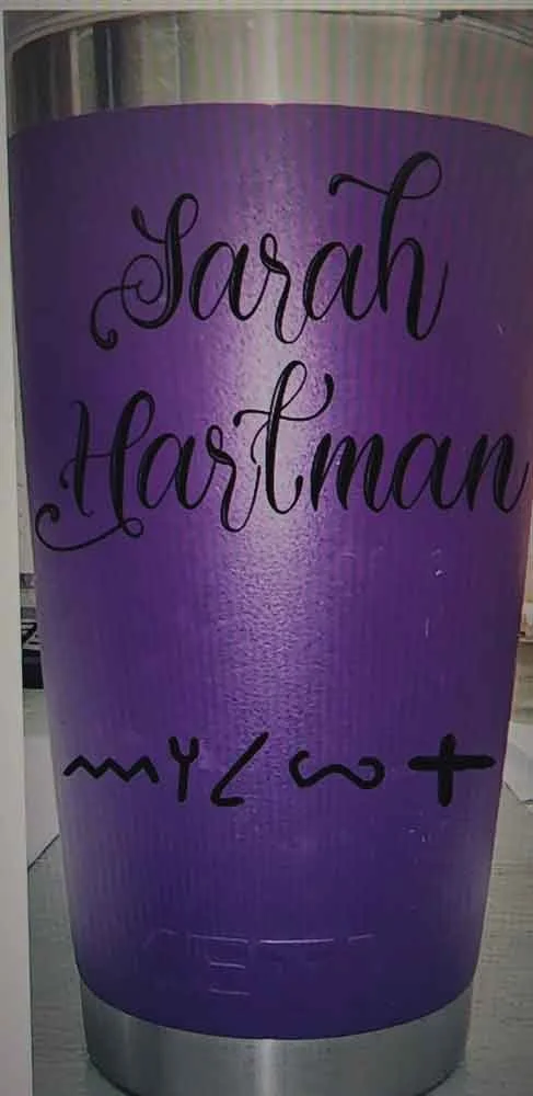 Purple sign with the names 'Sarah Hartman' and the word 'melt' written in black cursive and stylized handwriting.