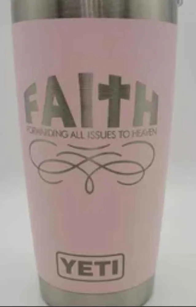 Pink tumbler with a Christian theme, featuring the word 'FAITH' with the 'I' shaped as a cross, and the phrase 'Confiding all issues to learn' above a decorative swirl design, and the YETI logo at the bottom.