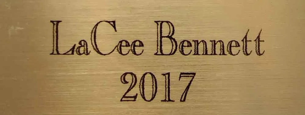Gold background with engraved text reading "LaCee Bennett 2017".