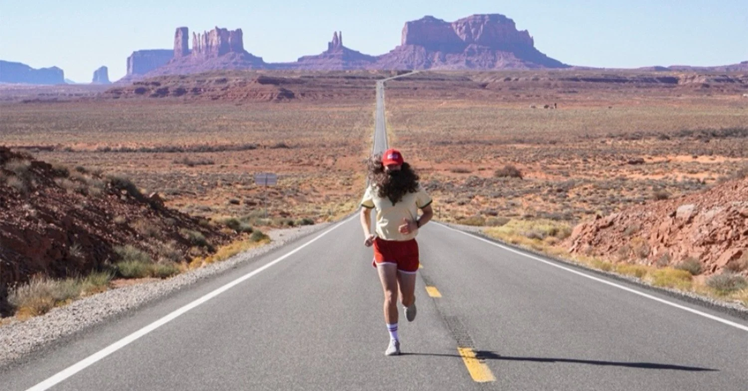 Nick Pelletier running on the road in Moab
